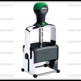 Green and white self-inking DXB Stamps heavy duty stamp with chrome handle.
