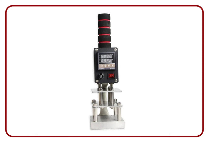 Black digital pressure gauge with red accents and ergonomic handle.