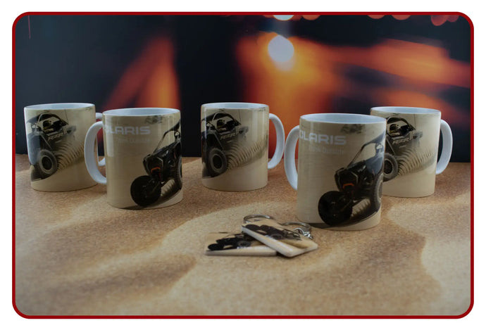 Ceramic mug set with motorcycle rider design, white background and black accents.