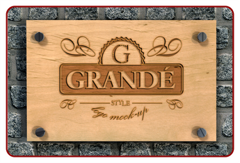 Wooden sign with 'GRANDE' branding on a stone wall background